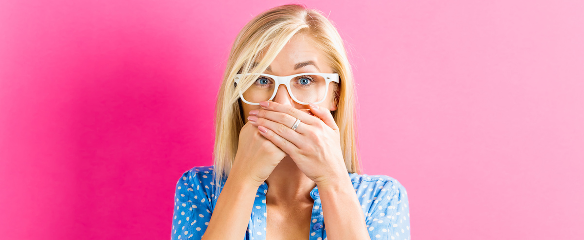 Young woman covering her mouth – Viden Advisory